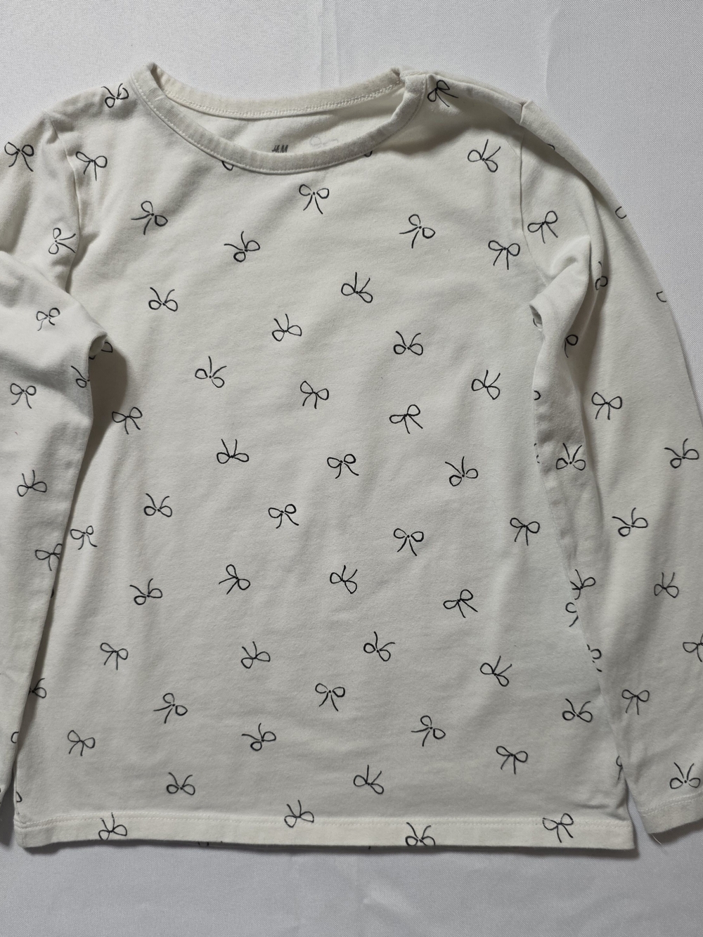 H&M Cream Long-Sleeve Tee with Black Bow Print